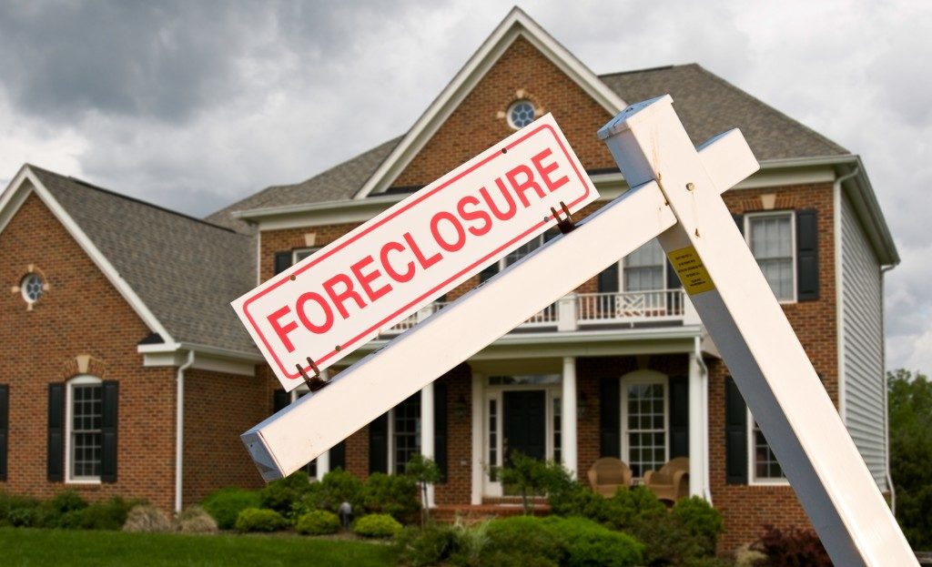 Foreclosure sign in front of a home