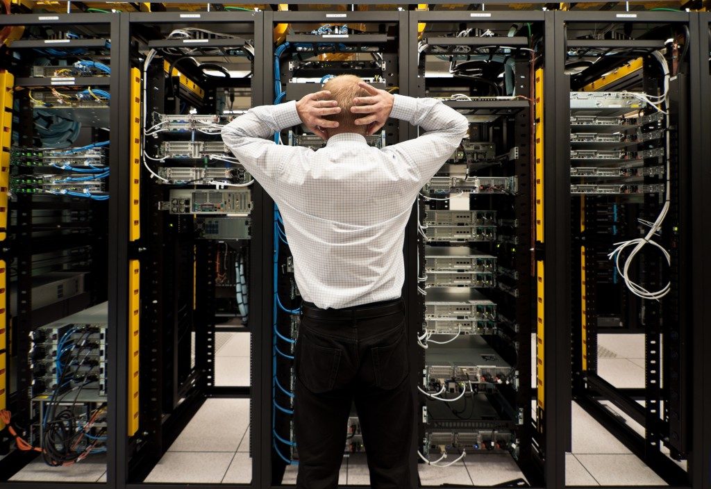 man looking at the data system