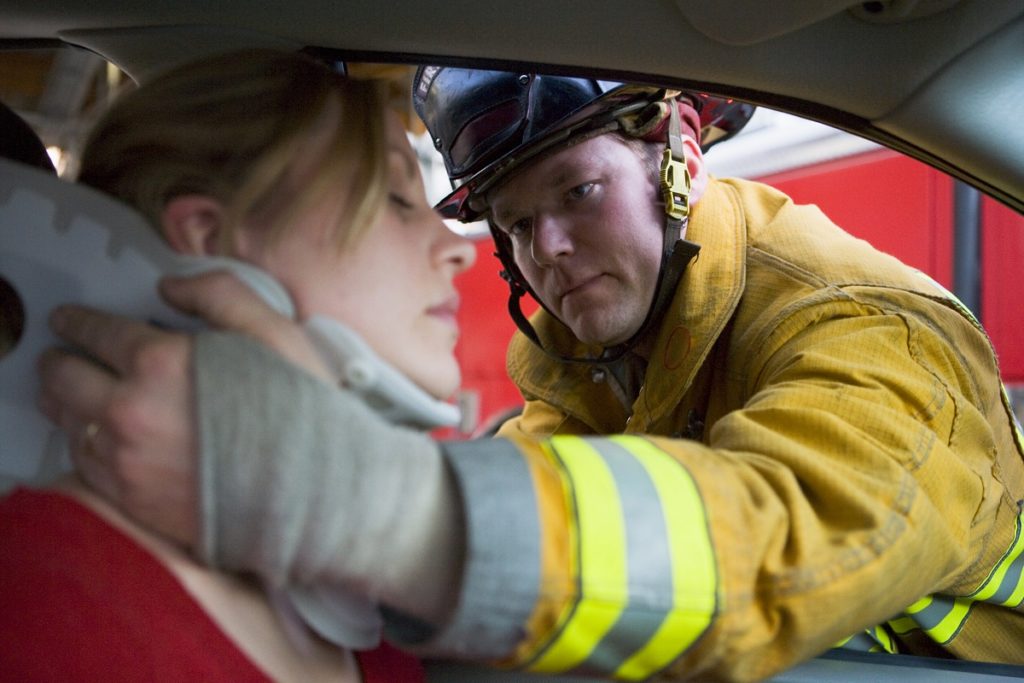 Firefighter rescuing a woman