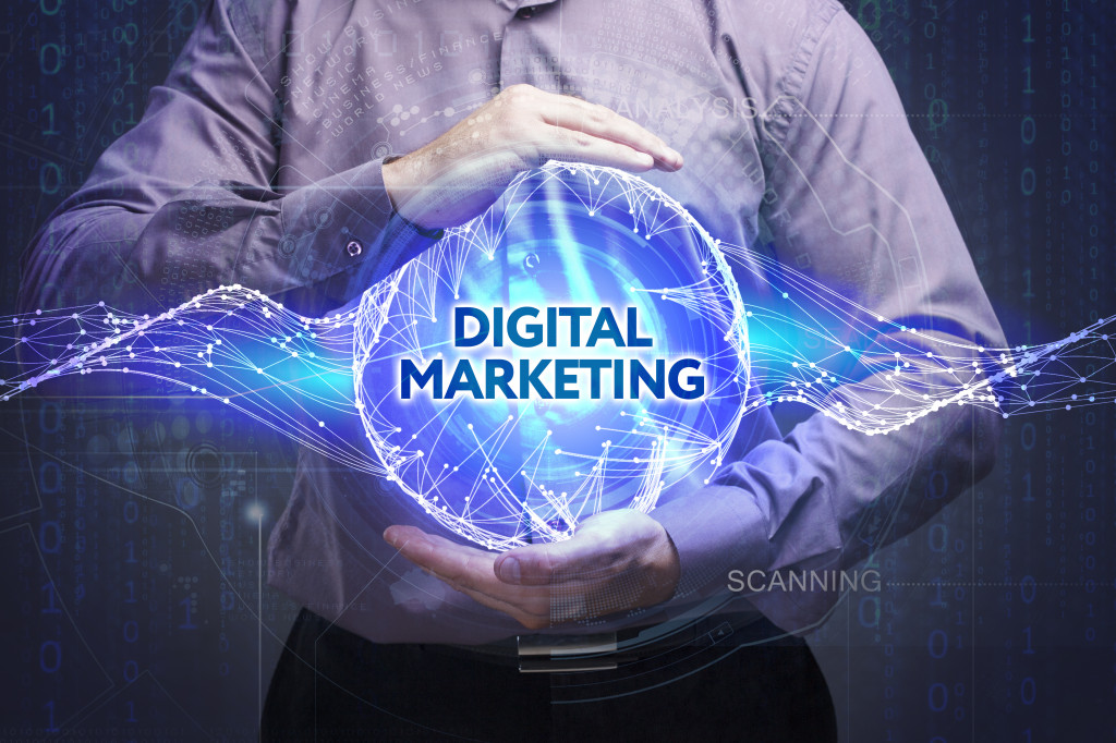 A person holding a hologram of Digital Marketing