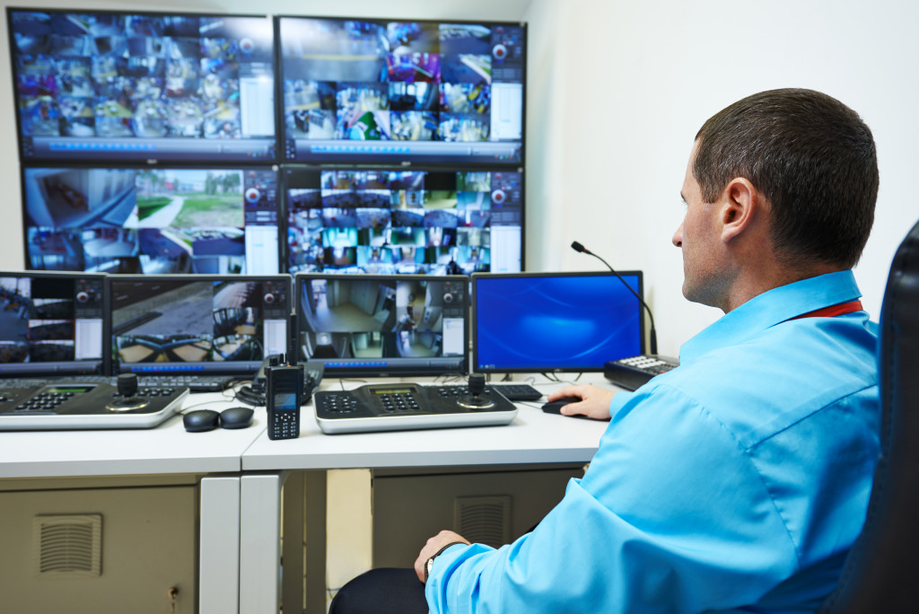 a person watching CCTV footage